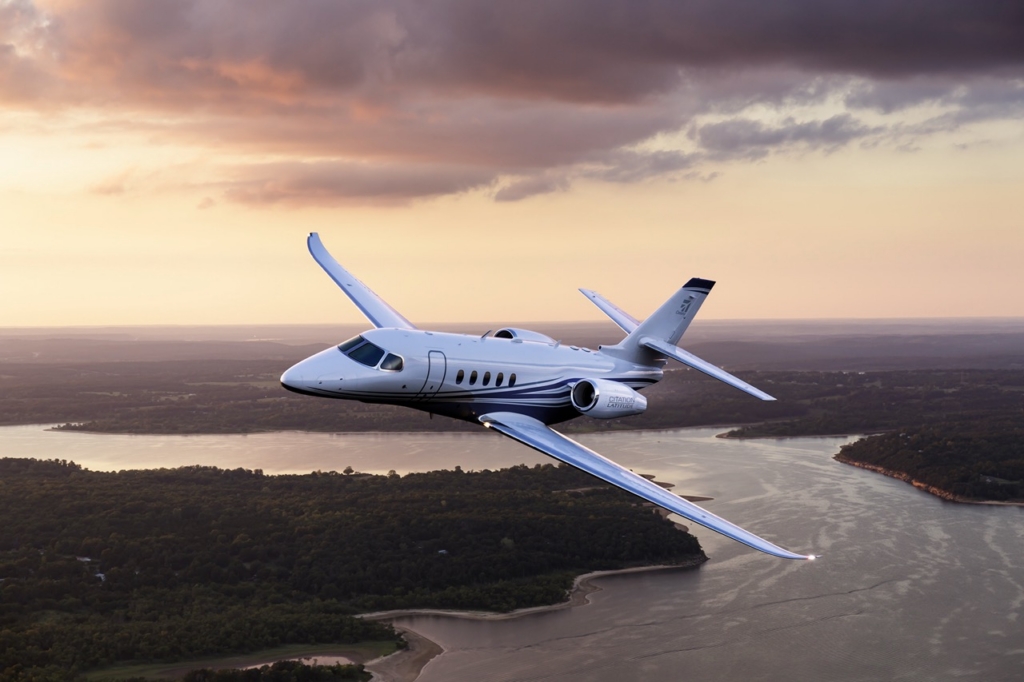 Aerial photography of the Textron Cessna Latitude business jet flying over Keystone Lake, west of Tulsa, OK. Mid-Continent Airport (ICT) Wichita KS USA