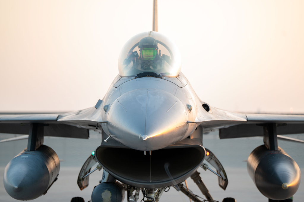 555th Expeditionary Fighter Squadron fighter pilot, conducts preflight procedures in an F-16C Fighting