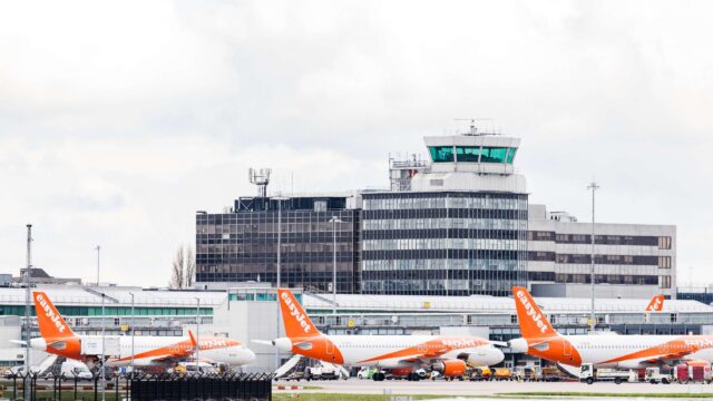 Easyjet Airbus A320-214 trio in front of the control tower at Manchester airport