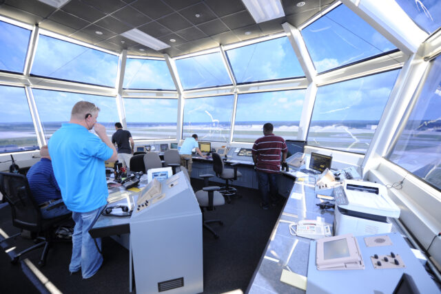Air traffic controllers direct air and ground operations atop the new air traffic control tower June 11, 2013, at Pope Field, N.C.