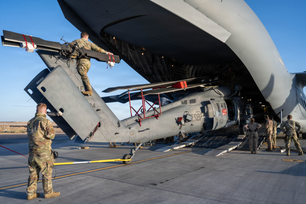 US airmen unload a HH-60W Jolly Green II combat search-and-rescue (CSAR) helicopter from a C-17A at an undisclosed location in the Middle East on 31 January 2026. Image: USAF/Senior Airman Kari Degraffenreed